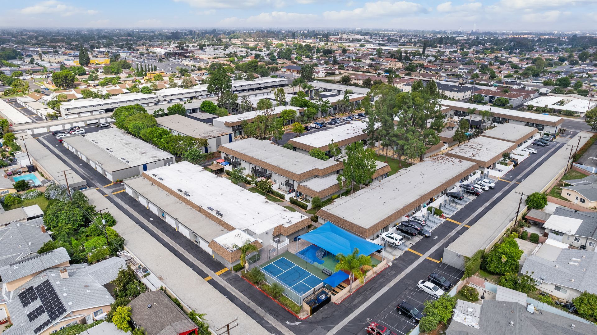 Above shot of community with buildings and sports court