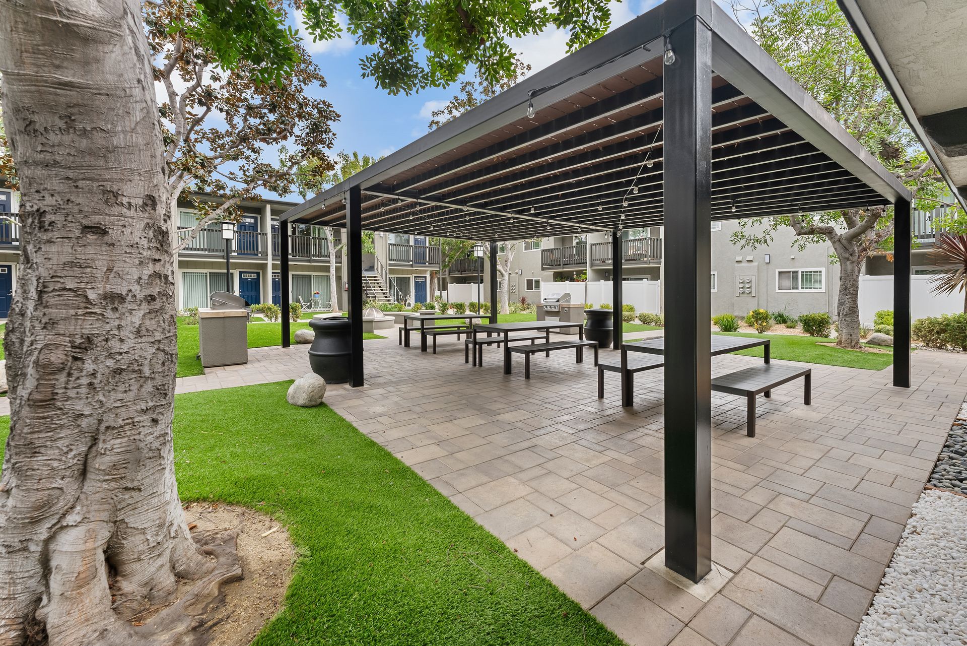 Exterior photo of canopy with picnic tables