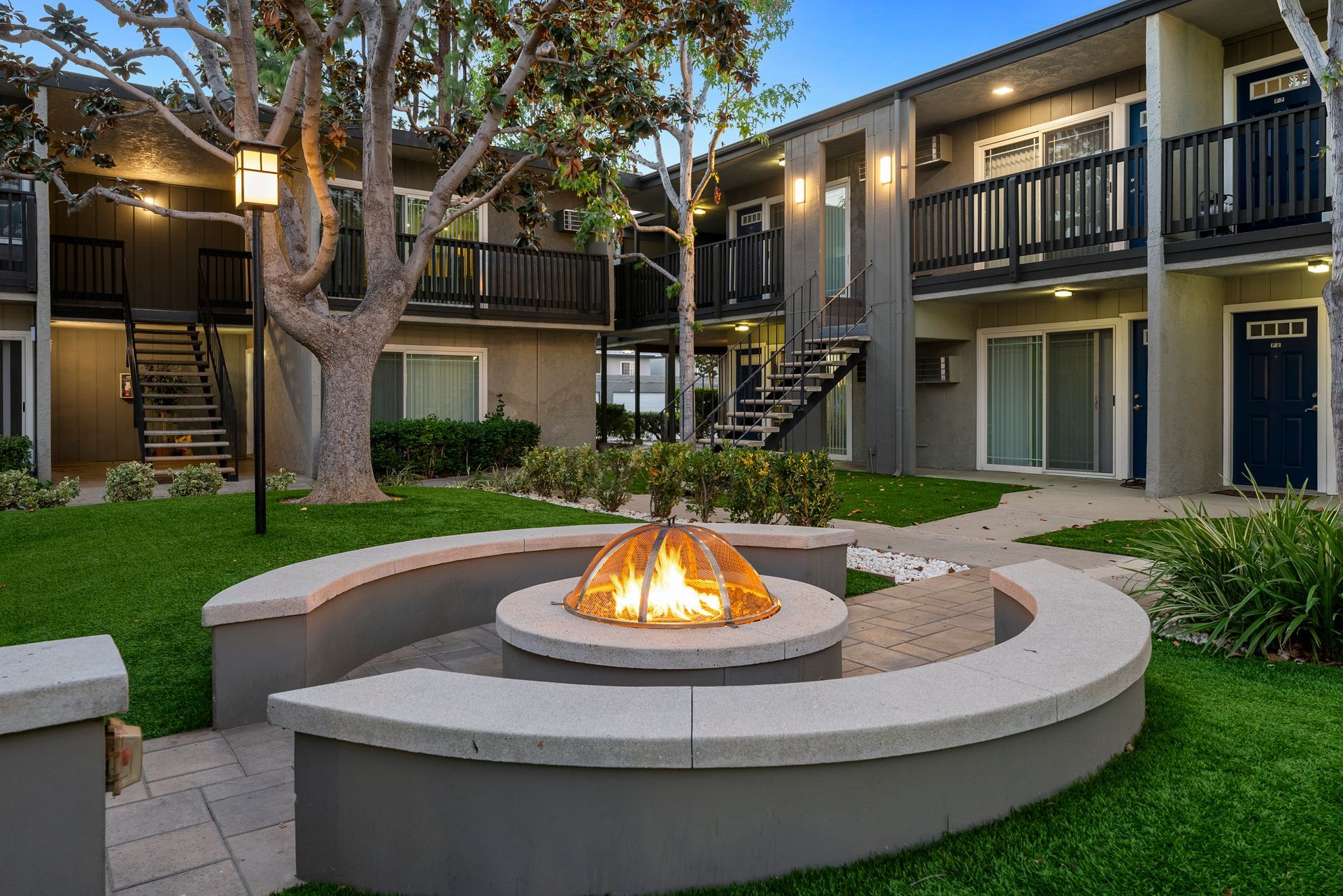 Firepite at twilight with exterior buildings behind