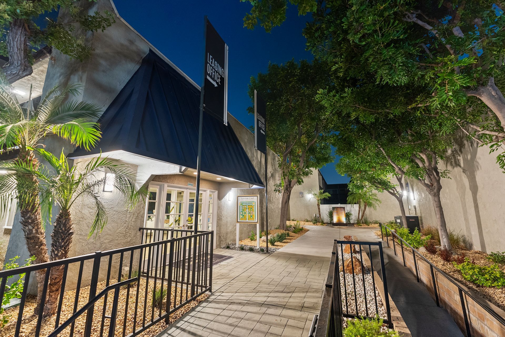 Exterior office with black flag at dusk