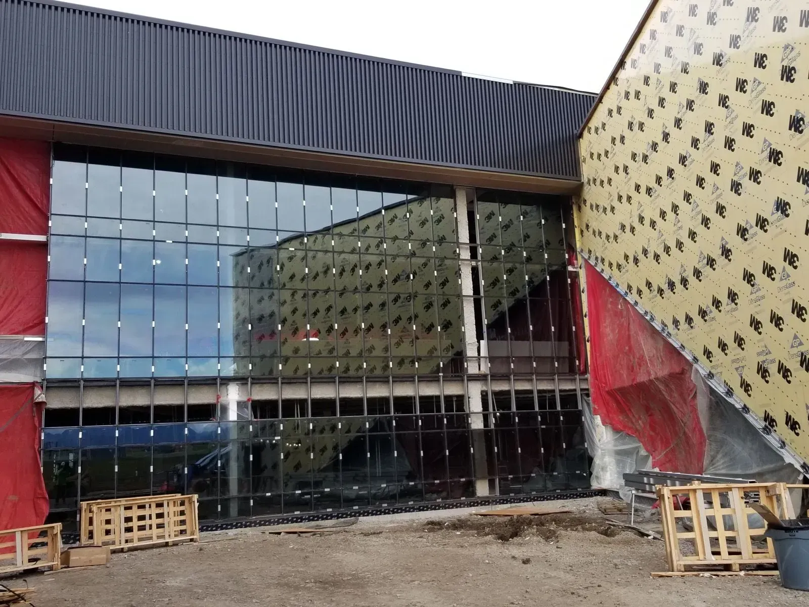 A large building with a lot of windows is being built