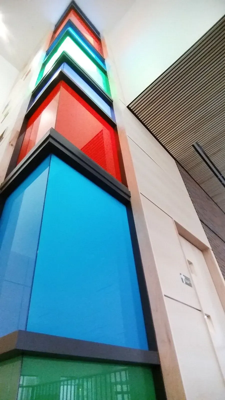 A stack of colorful boxes are stacked on top of each other