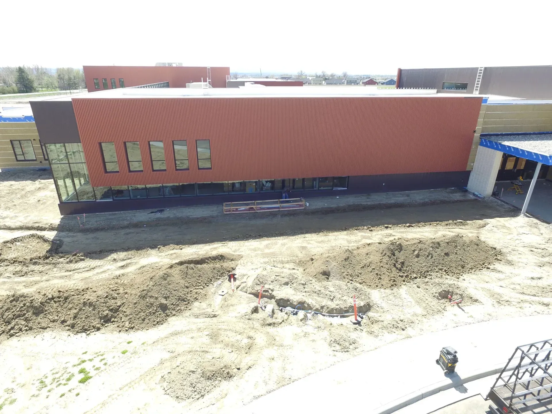 An aerial view of a large building under construction.