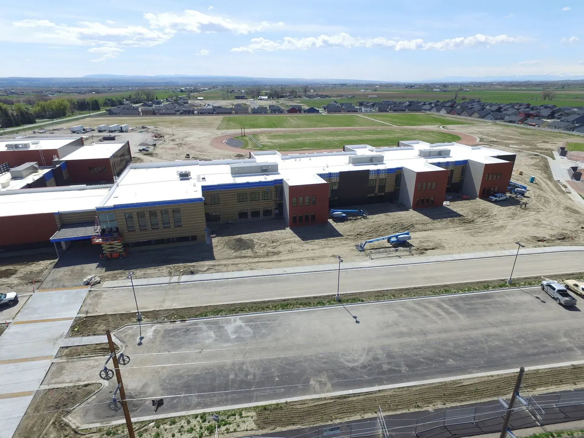 An aerial view of a large building under construction