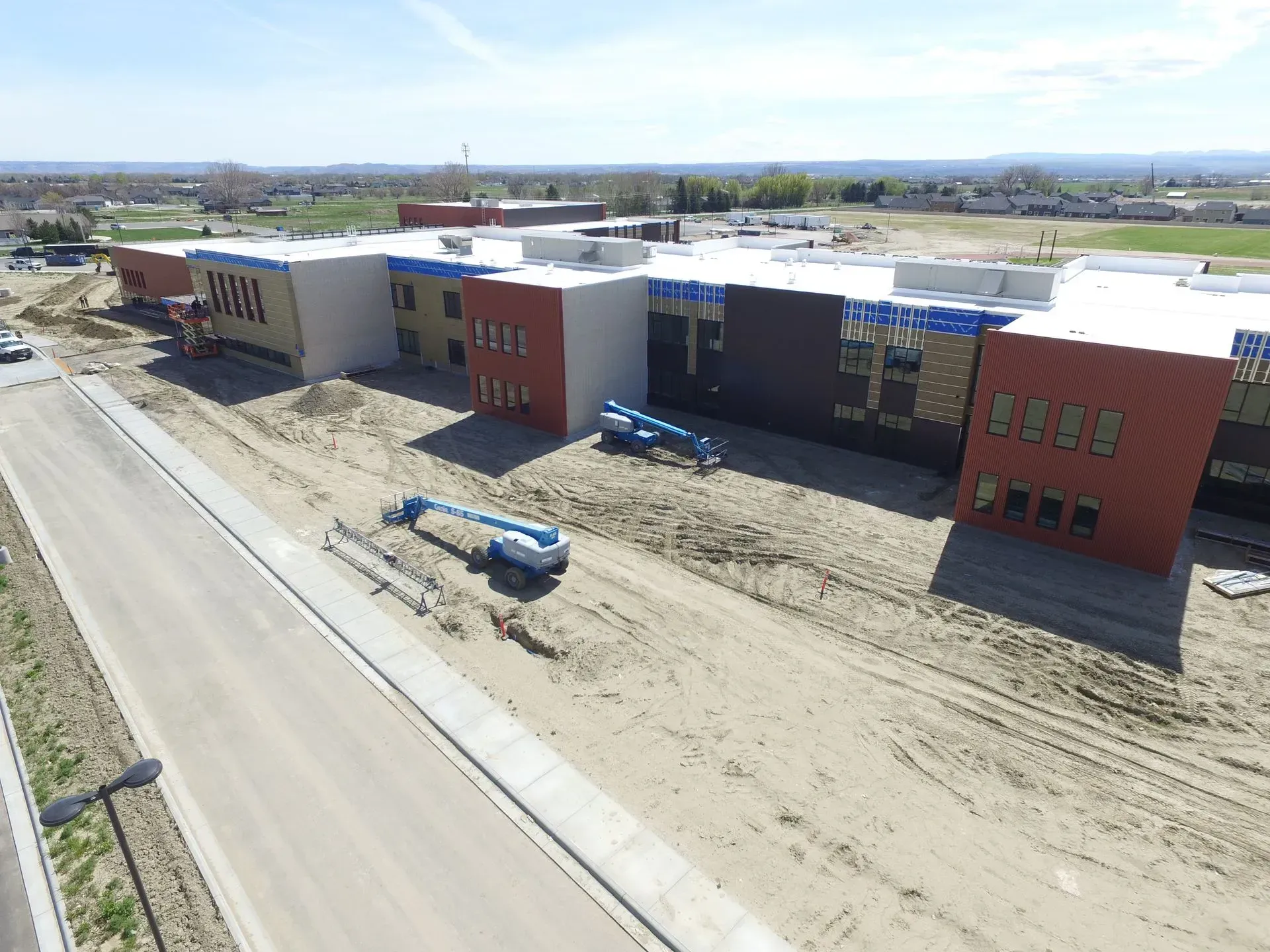 An aerial view of a large building under construction