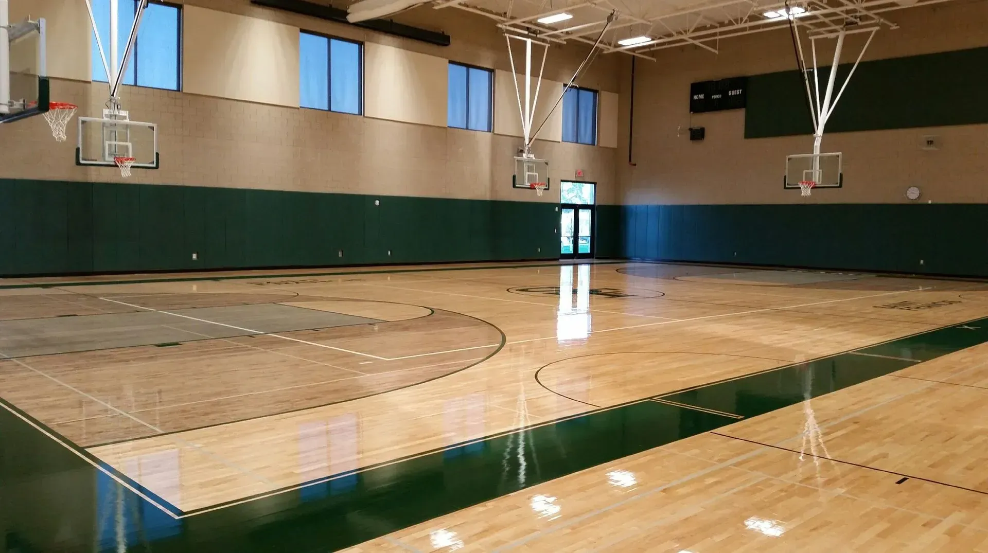 An empty basketball court with a wooden floor