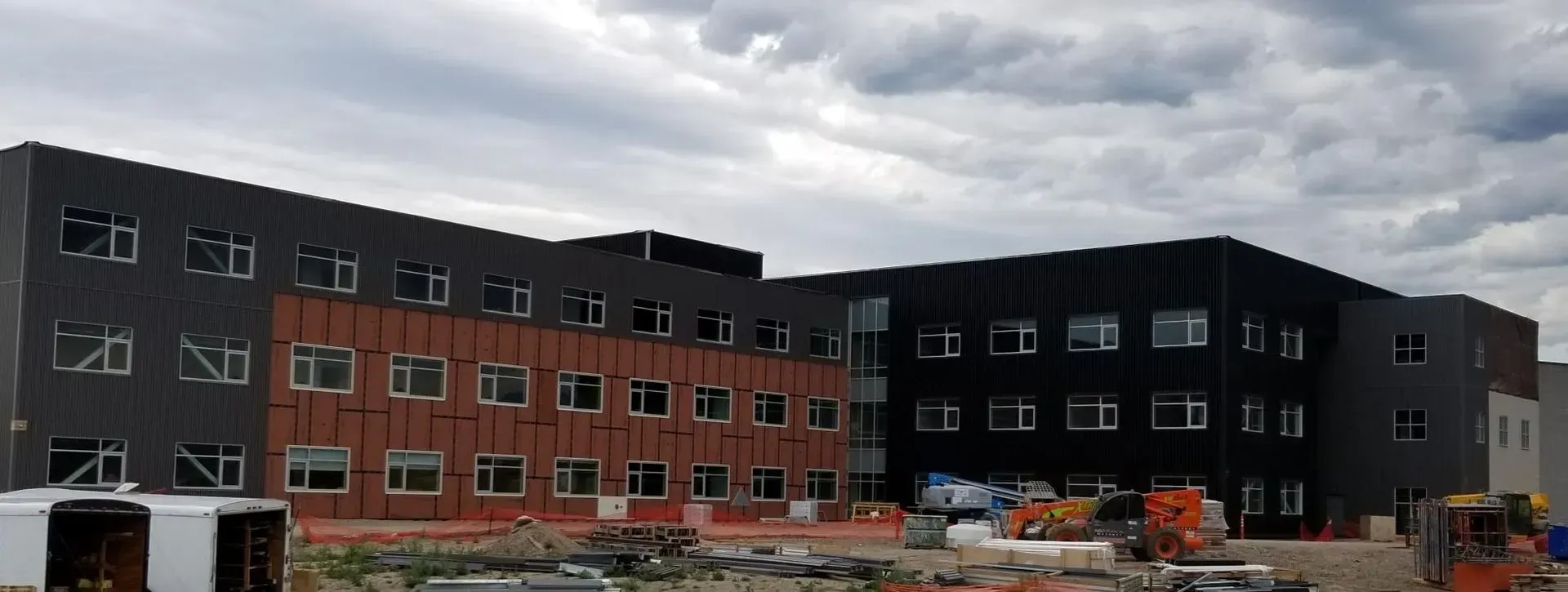 A large building with a lot of windows is being built.