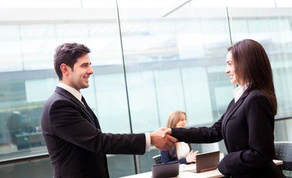 A man and woman shaking hands