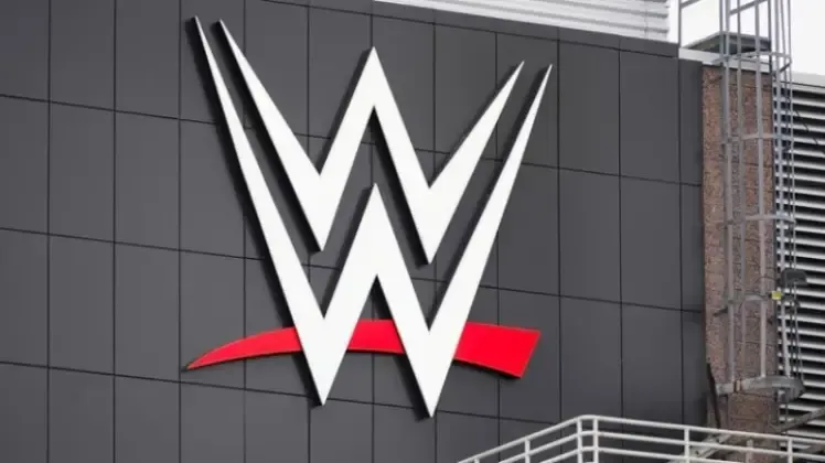 A large w logo is on the side of a building