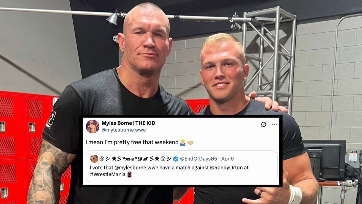 Two men are posing for a picture together in a gym.