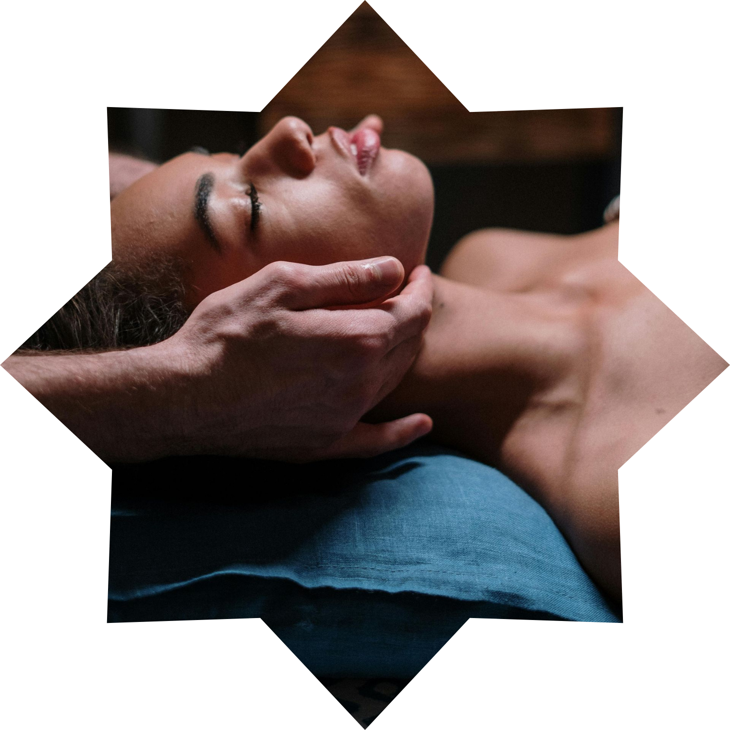 A man is giving a woman a massage on her back.