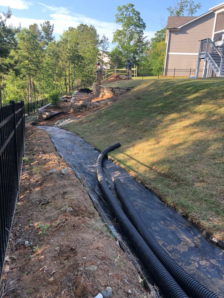 Placing Water Catcher — Flowery Branch, GA — All About Irrigation & Landscape Services