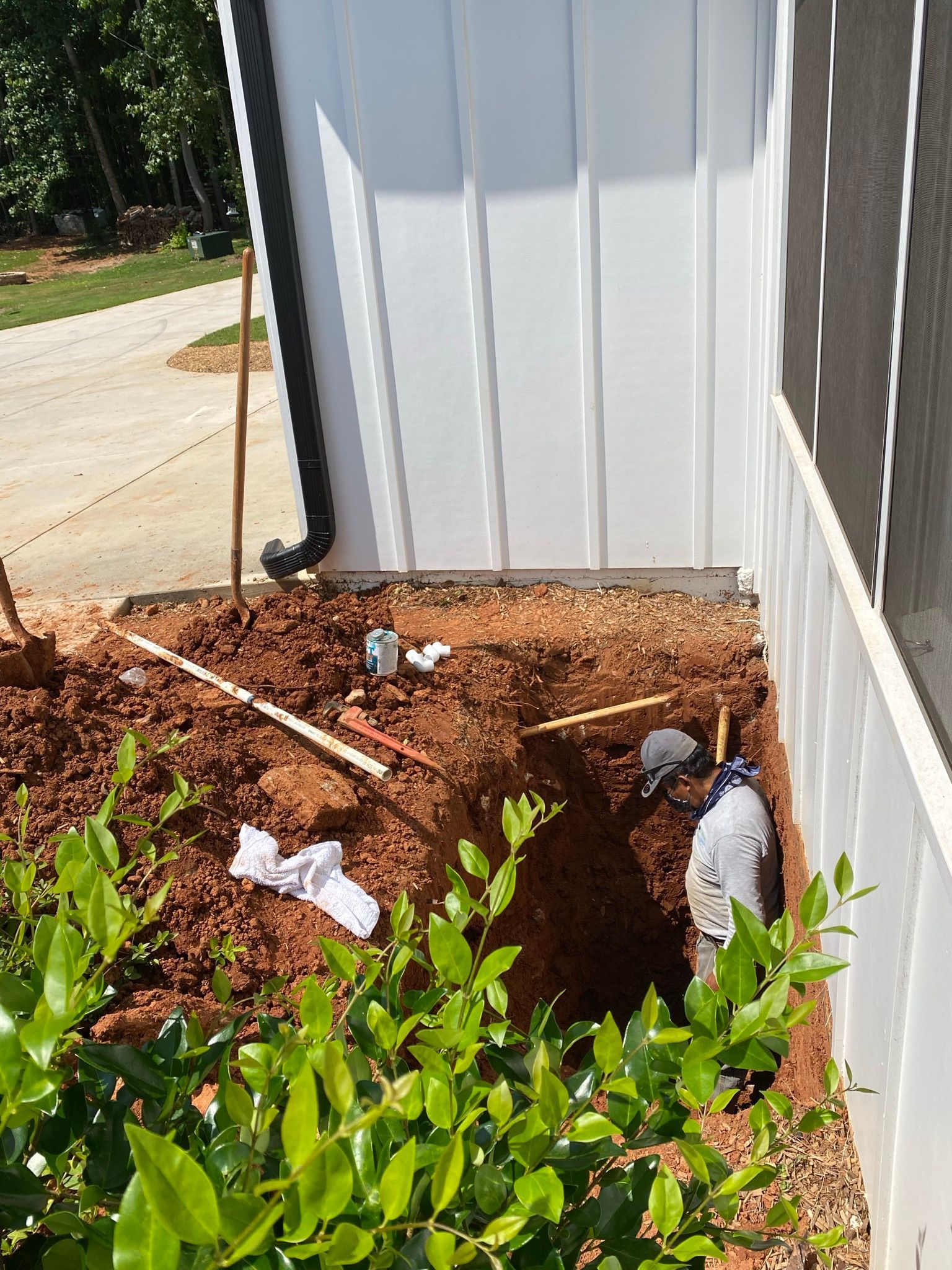 Man Standing on a Pit — Flowery Branch, GA — All About Irrigation and Landscape Services Inc