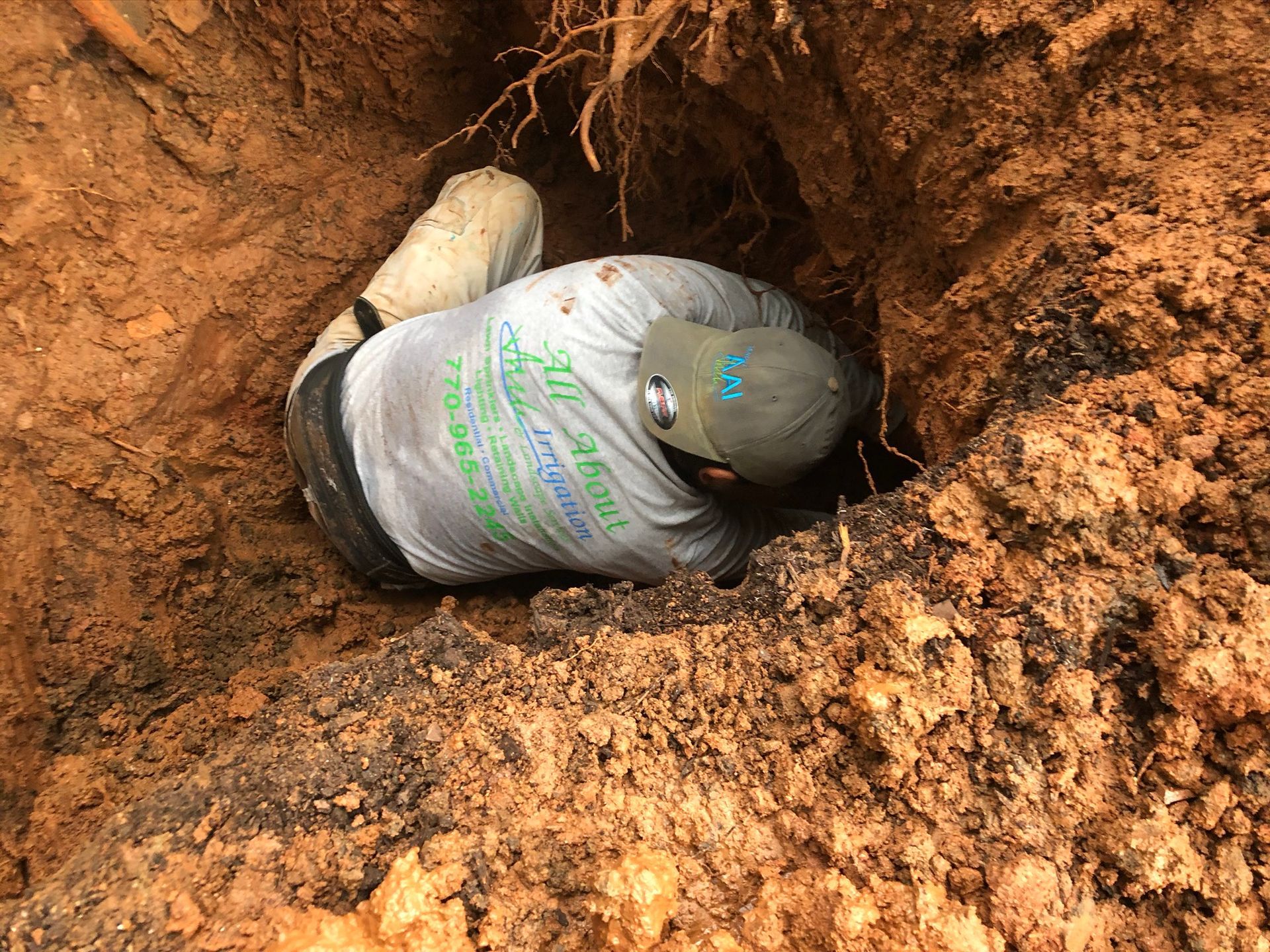 Man in a Dig — Flowery Branch, GA — All About Irrigation and Landscape Services Inc