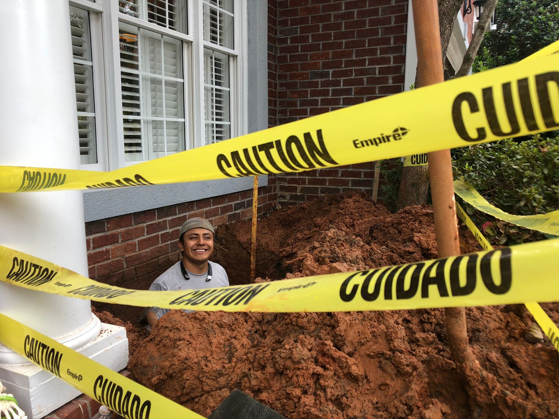 Man Smiling while on a Pit — Flowery Branch, GA — All About Irrigation and Landscape Services Inc
