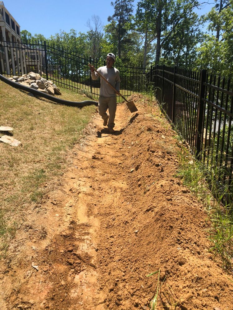 Man Holding Shovel — Flowery Branch, GA — All About Irrigation & Landscape Services