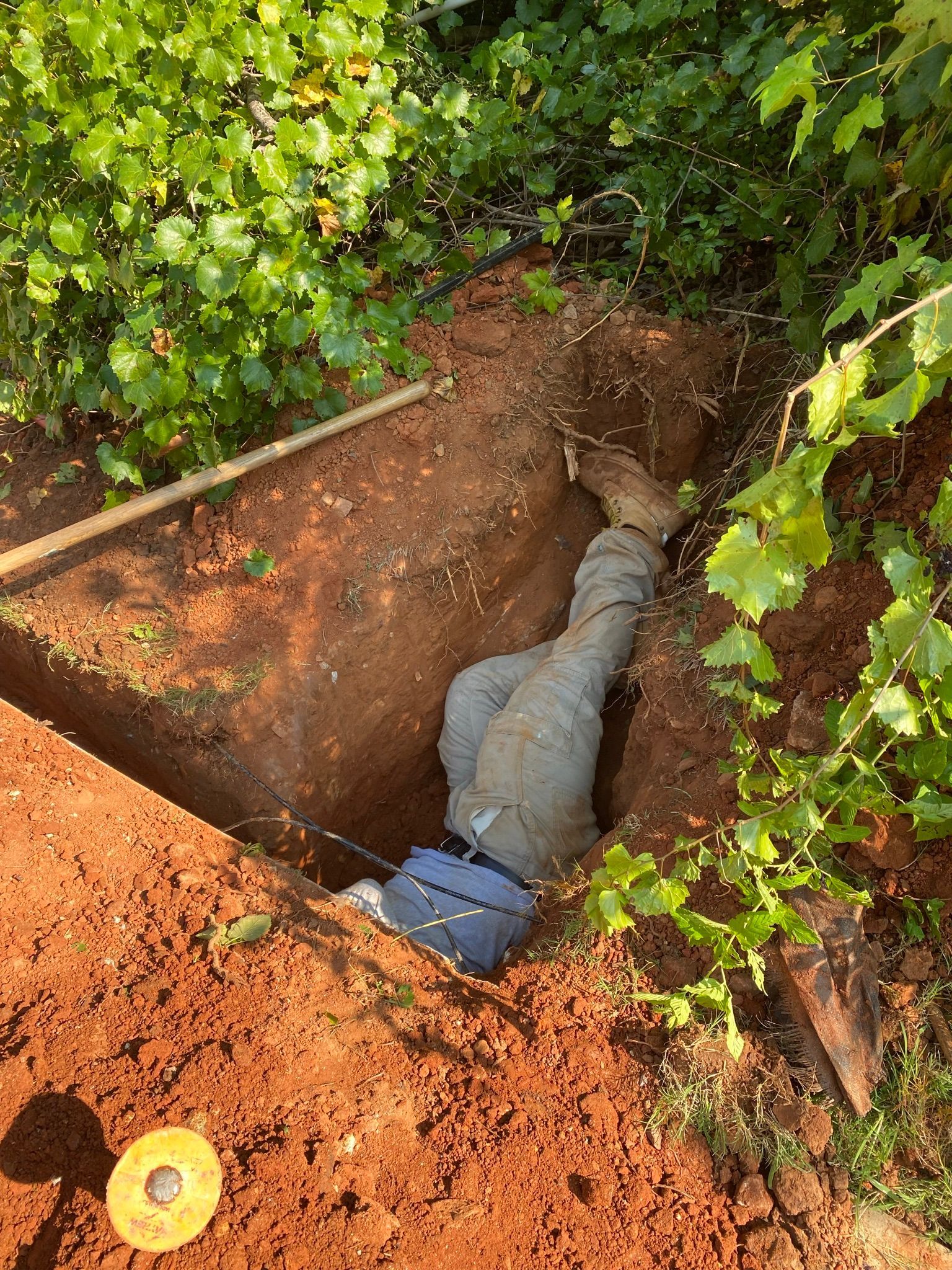 Man Doing Work — Flowery Branch, GA — All About Irrigation and Landscape Services Inc