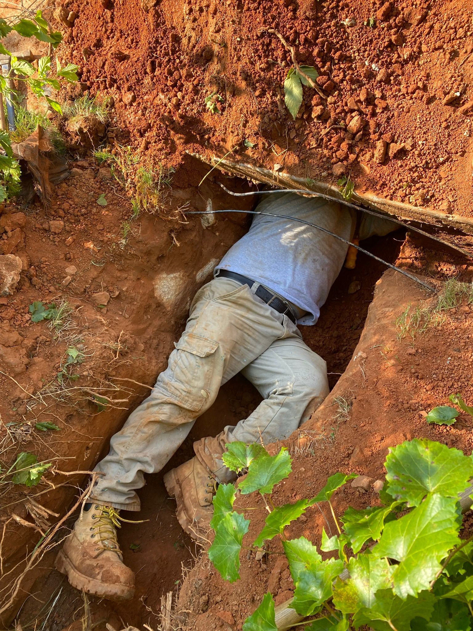 Another Shot of the Man under the Pit — Flowery Branch, GA — All About Irrigation and Landscape Services Inc