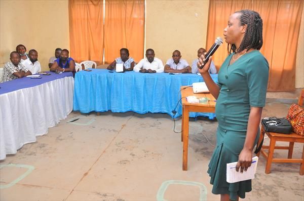 Woman speaking at Reach Rwanda
