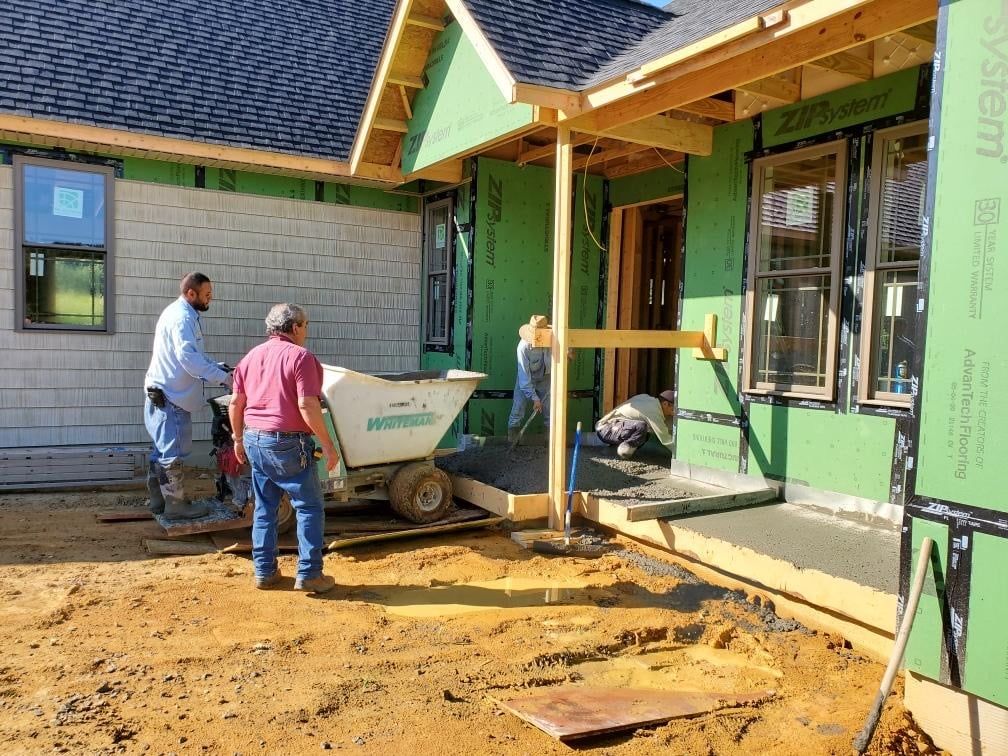 men building a house