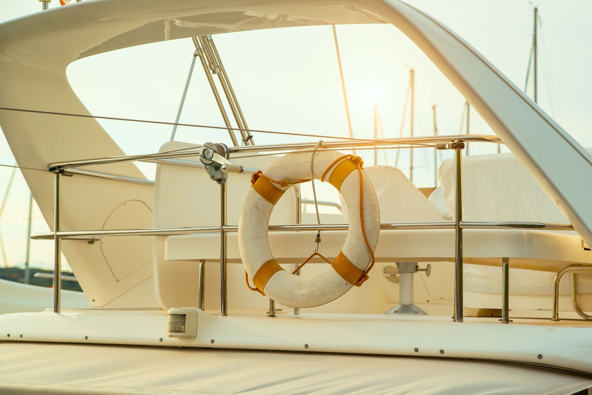 A life preserver is hanging on the side of a boat.