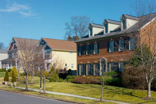 A row of houses on a sunny day in a residential neighborhood.