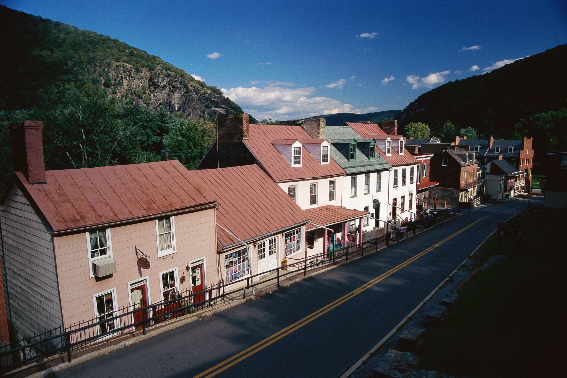 A row of houses on the side of a road