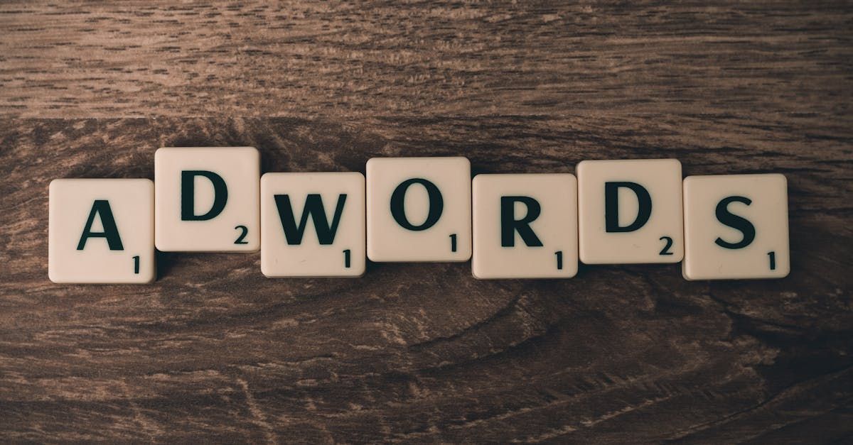 Scrabble tiles spell out the word adwords on a wooden table