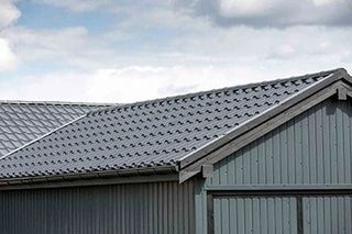 Gray roof with gutter — Metal roofs in Riceville, TN