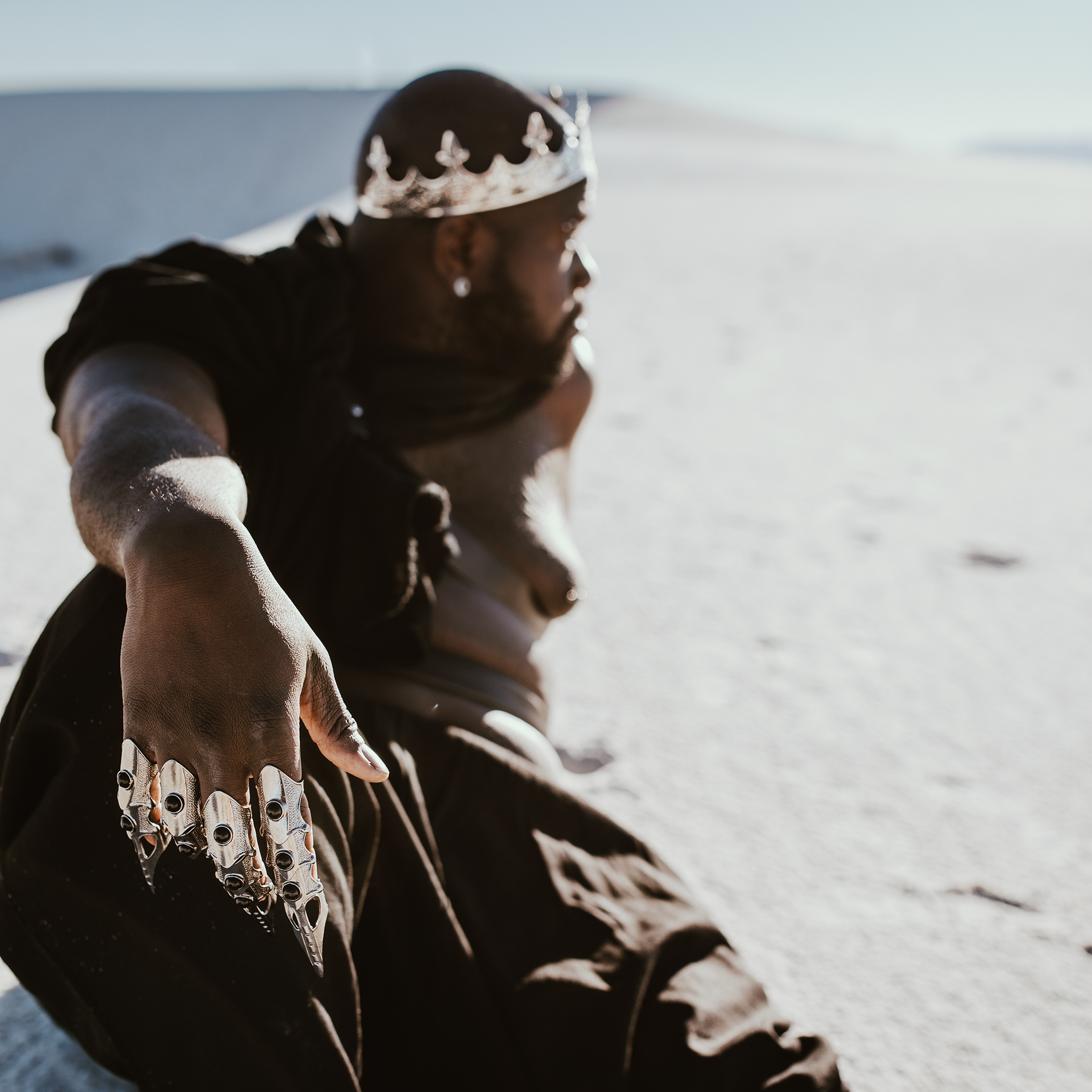 Man dressed as a king in a desert