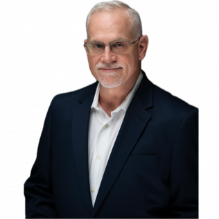 Man with gray hair and glasses in a navy blue suit and white shirt, smiling.