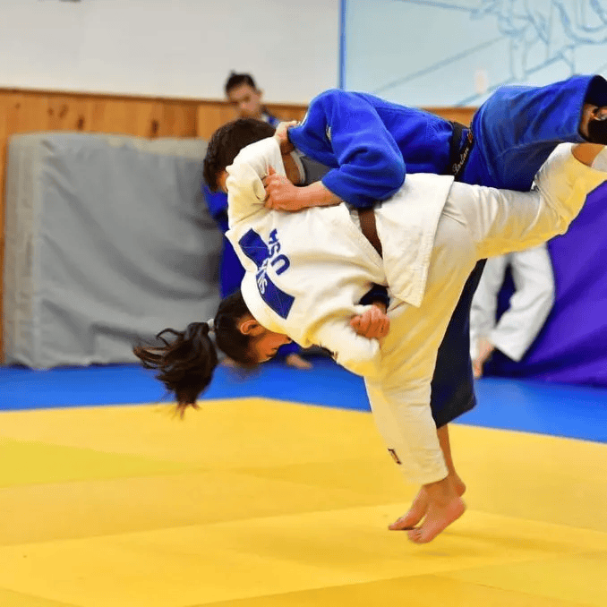 Adults drilling grappling technique at Infinity Jiu-jitsu and Judo in Timonium, MD for fitness.