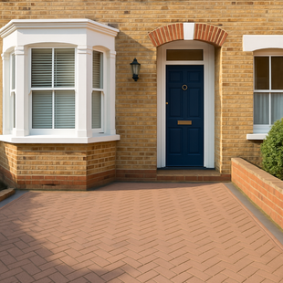 A brick house with a blue door and white trim