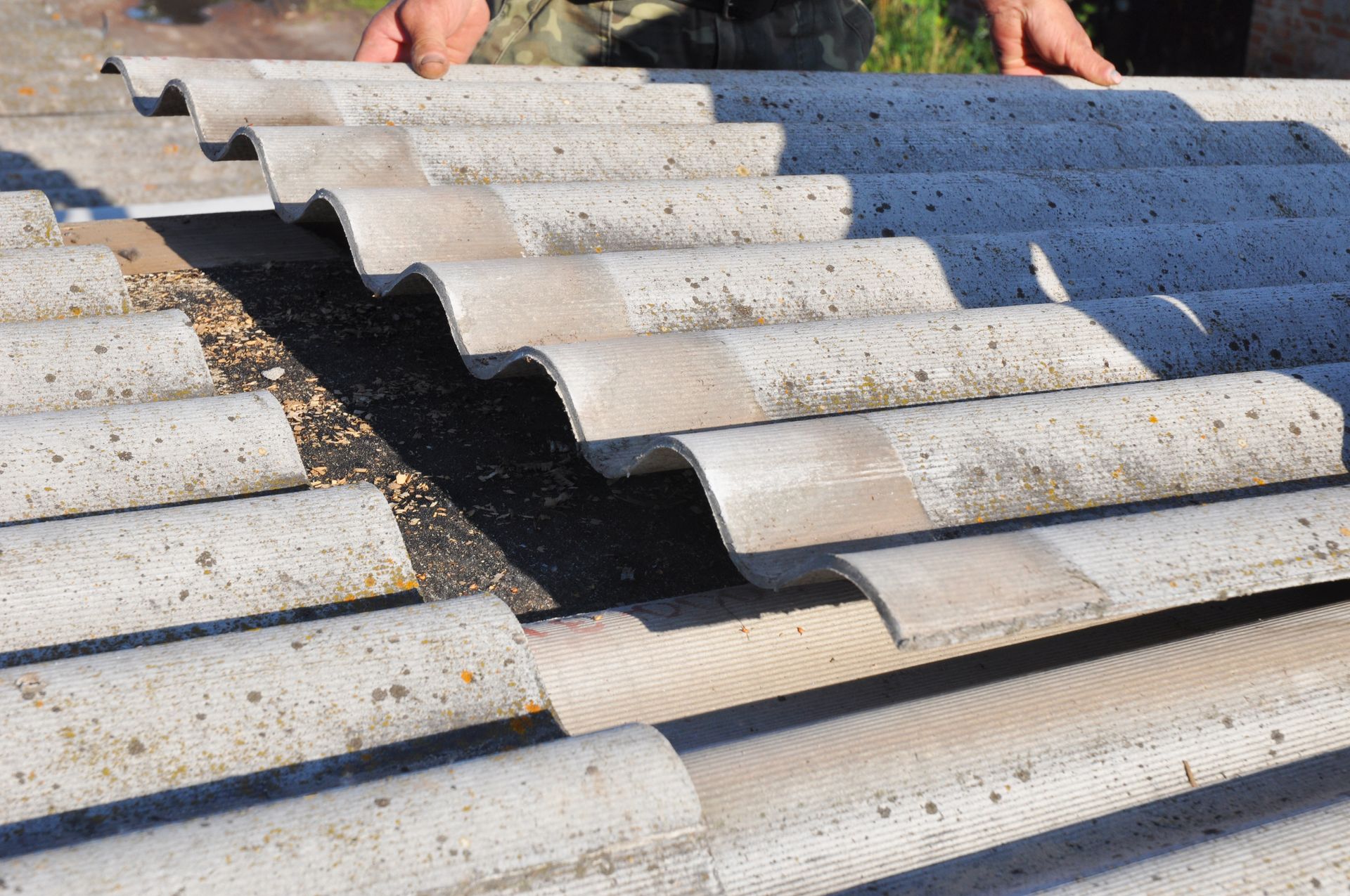 professionals performing safe asbestos roof removal