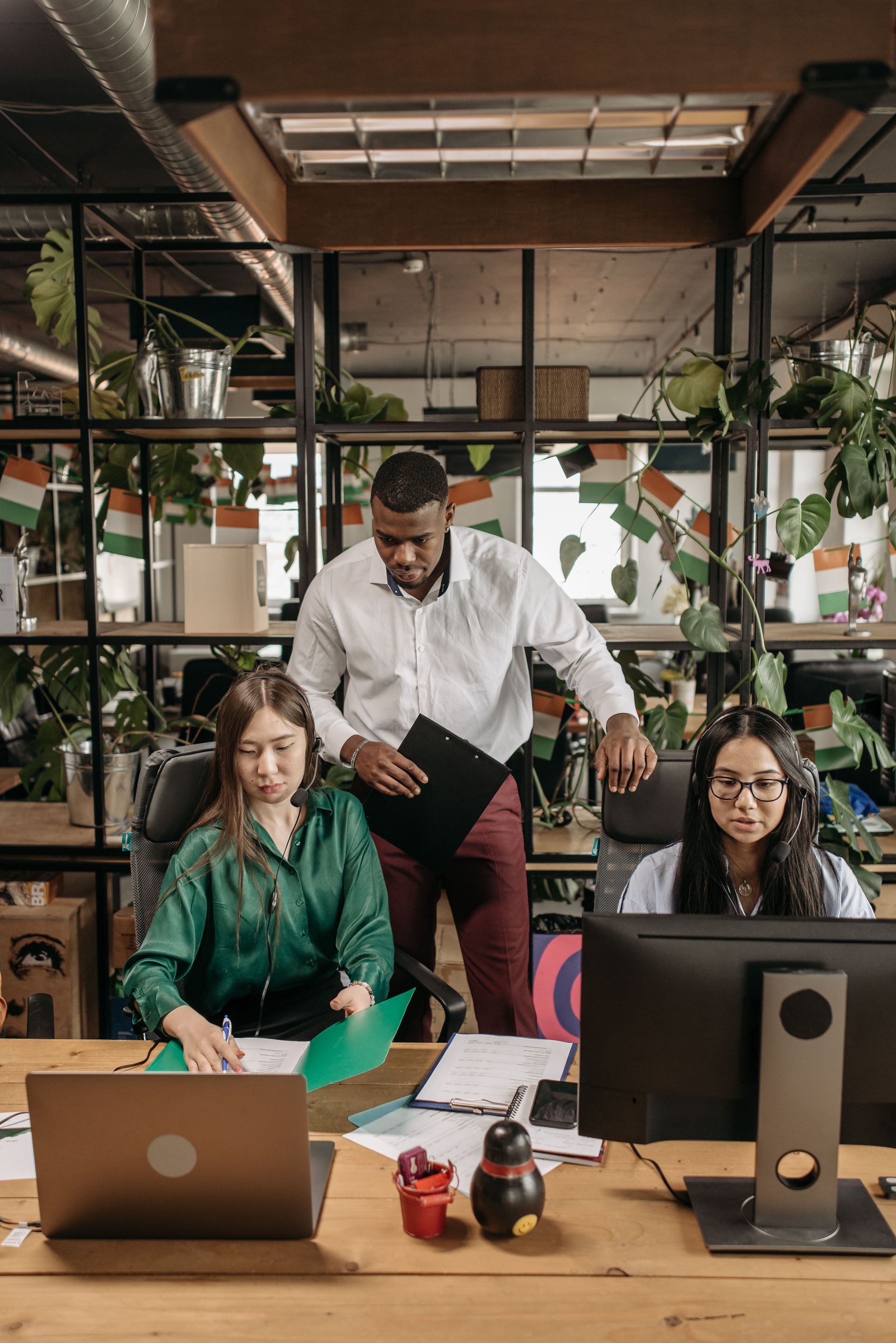 A business team working steadily and calmly in a productive bright modern office.