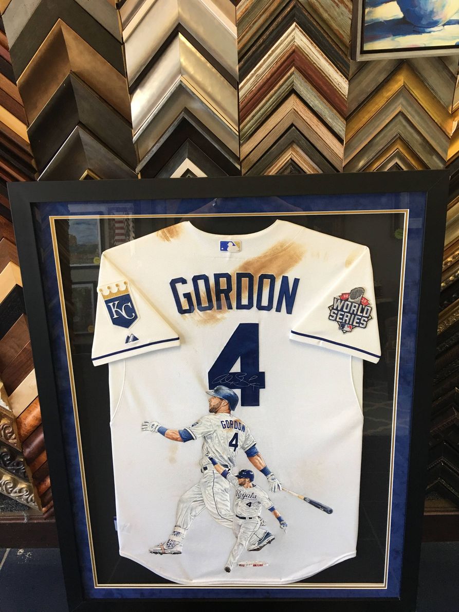 A framed, autographed Patrick Mahomes Kansas City Chiefs jersey with a Super Bowl LIV logo in a display case.