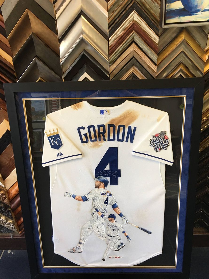 A framed, autographed Patrick Mahomes Kansas City Chiefs jersey with a Super Bowl LIV logo in a display case.