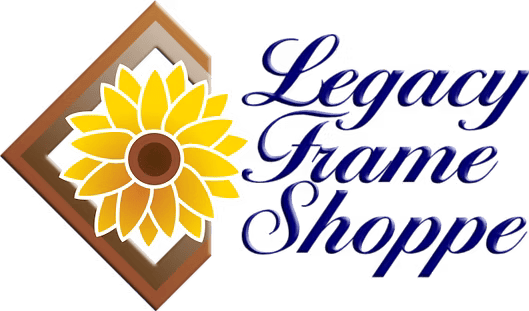 A logo for Legacy Frame Shoppe featuring a yellow sunflower centered within a brown wooden picture frame.