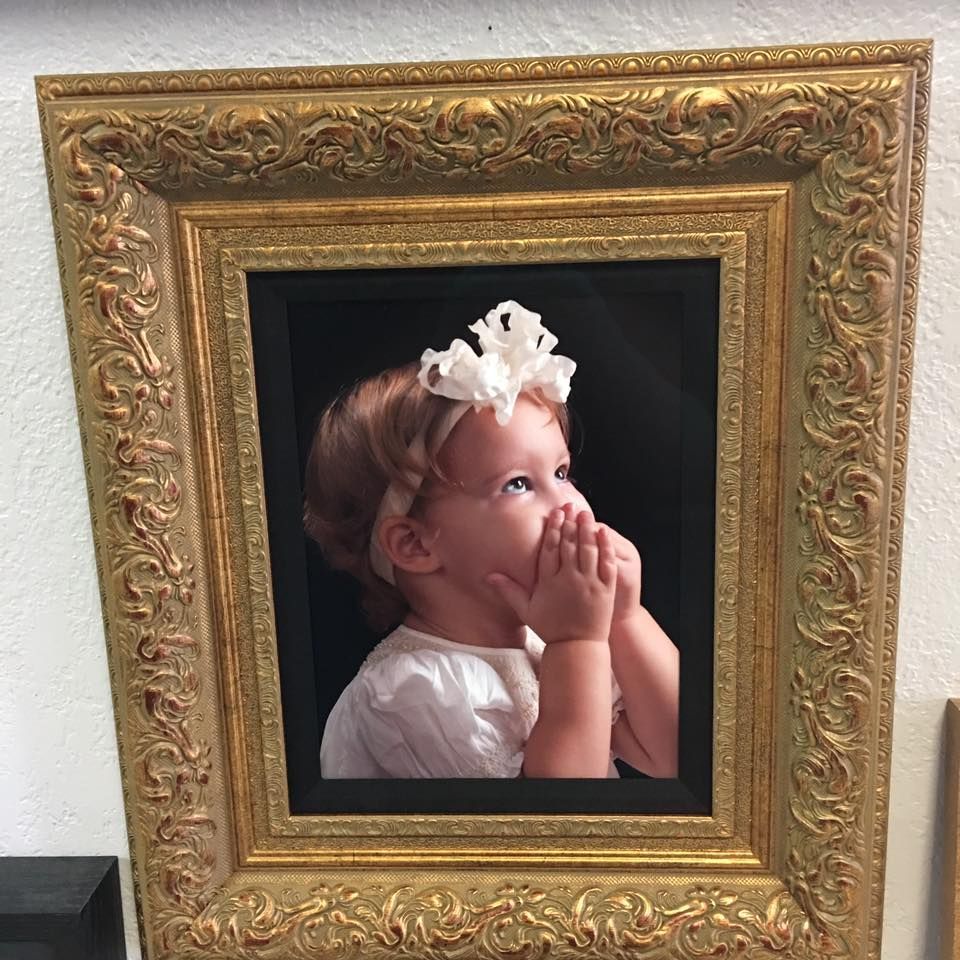 A framed art print of the Las Vegas Strip at night, featuring glowing fountains and colorful fireworks in the sky.