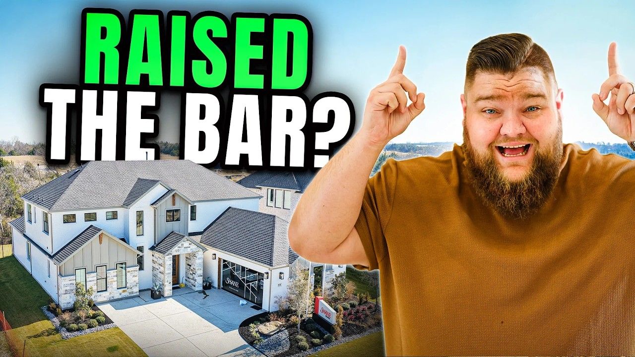 A smiling person gestures toward a large, modern white house with a stone facade, under the text 