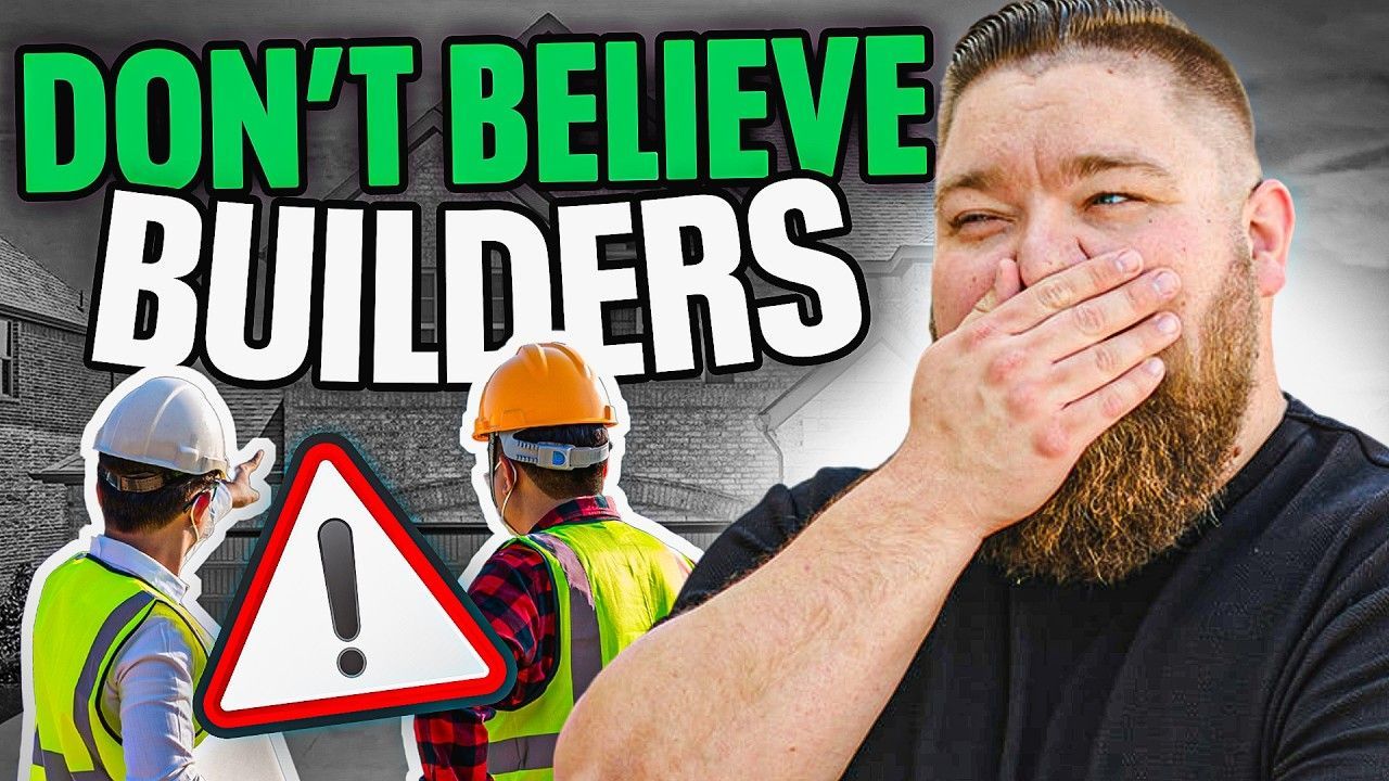A man with a beard is covering his mouth with his hand.