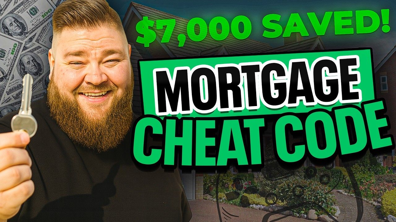 A man with a beard is holding a key in front of a house.