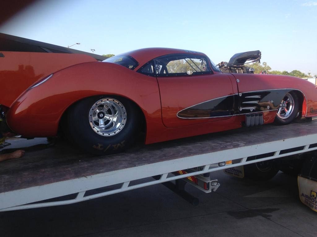 Orange Custom Drag Racer on a Flatbed Tow Truck — Banjo's Anytime Towing in Humpty Doo, NT