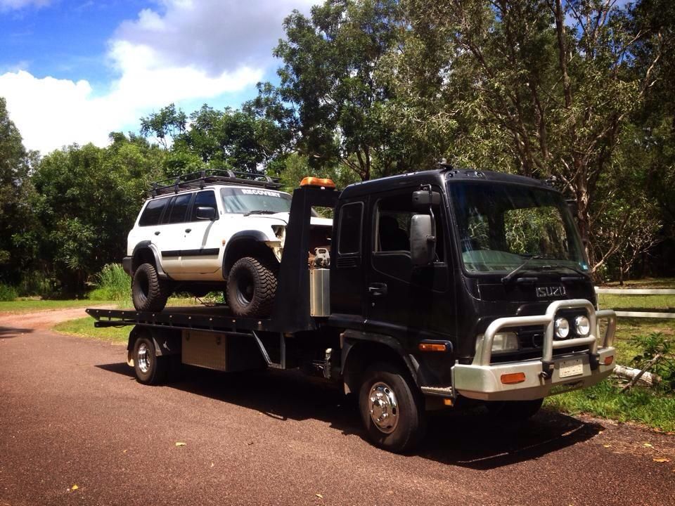 Black Tow Truck Carrying a White Suv — Banjo's Anytime Towing in Darwin, NT