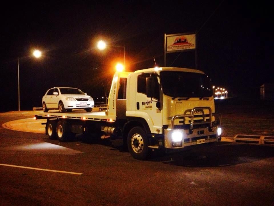 A White Tow Truck With a White Car — Banjo's Anytime Towing in Humpty Doo, NT