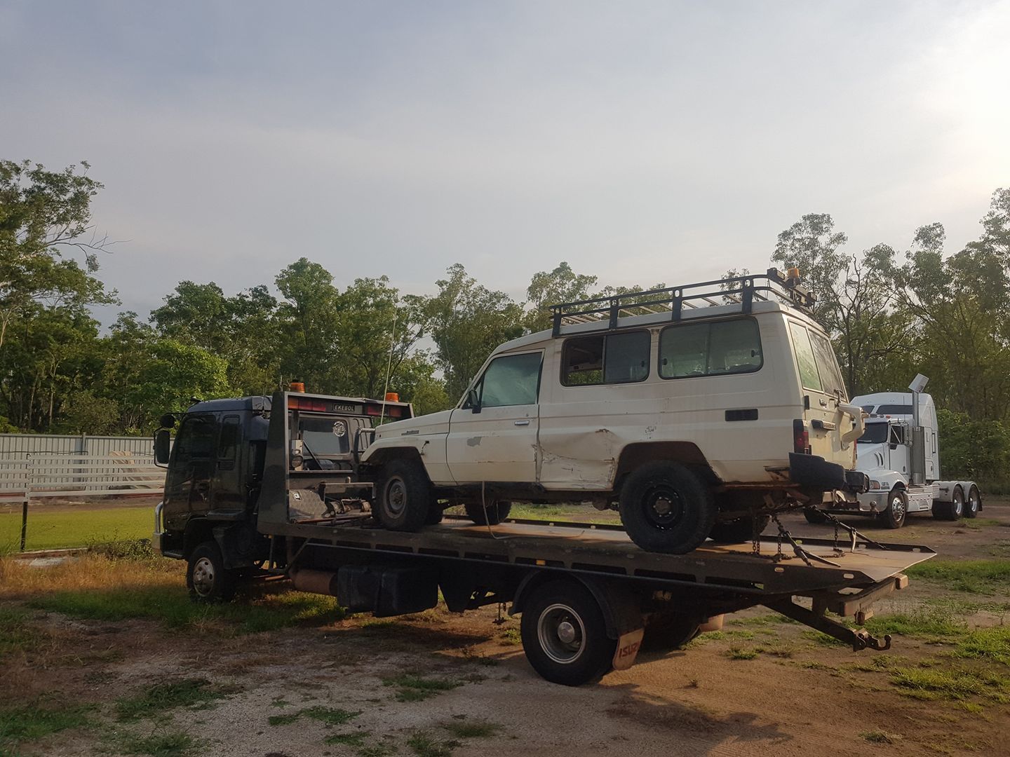 A White Suv on a Flatbed Truck, Possibly Being Towed — Banjo's Anytime Towing in Darwin, NT