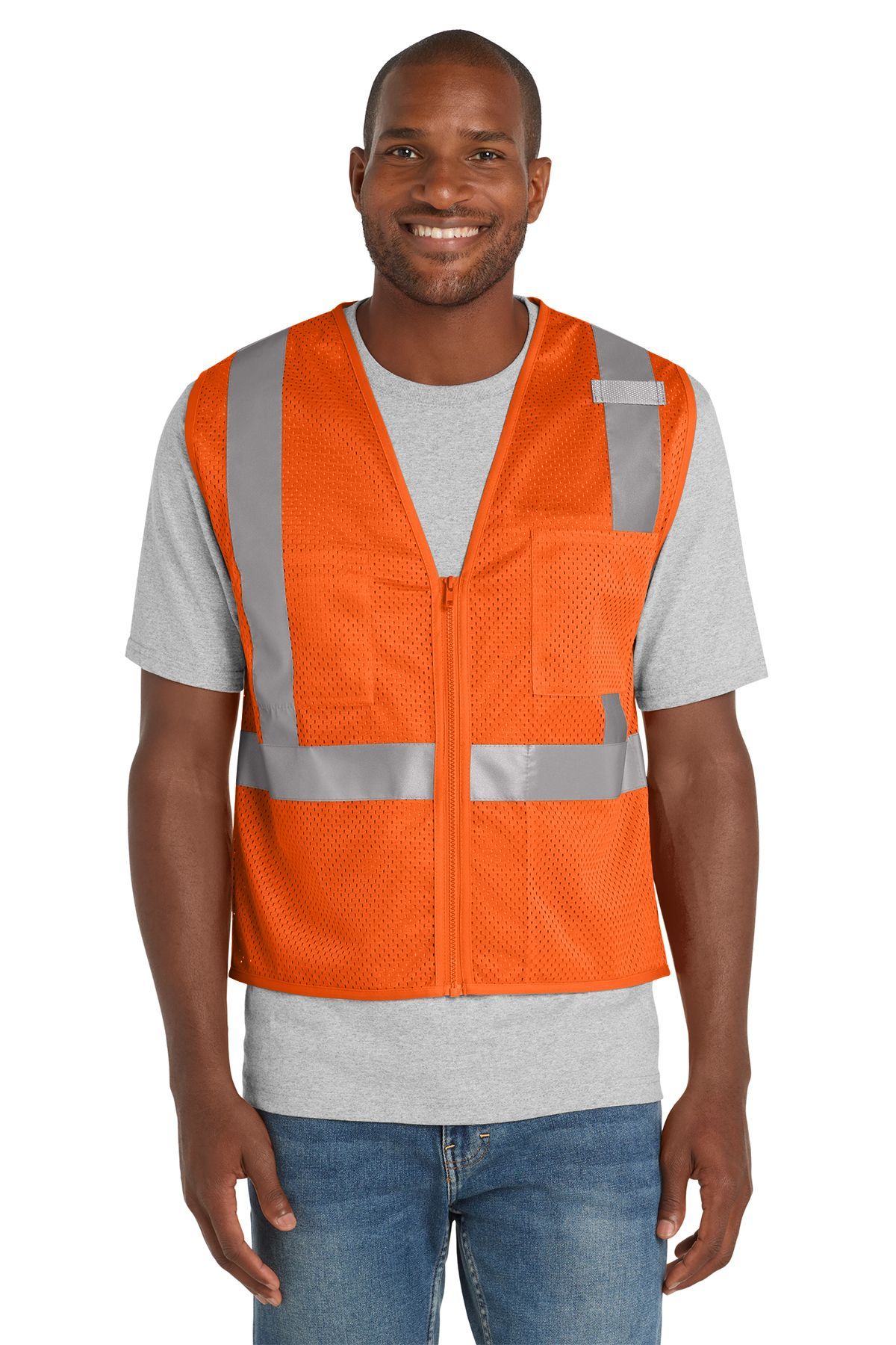 Man wearing orange reflective safety vest with gray shirt and blue jeans.