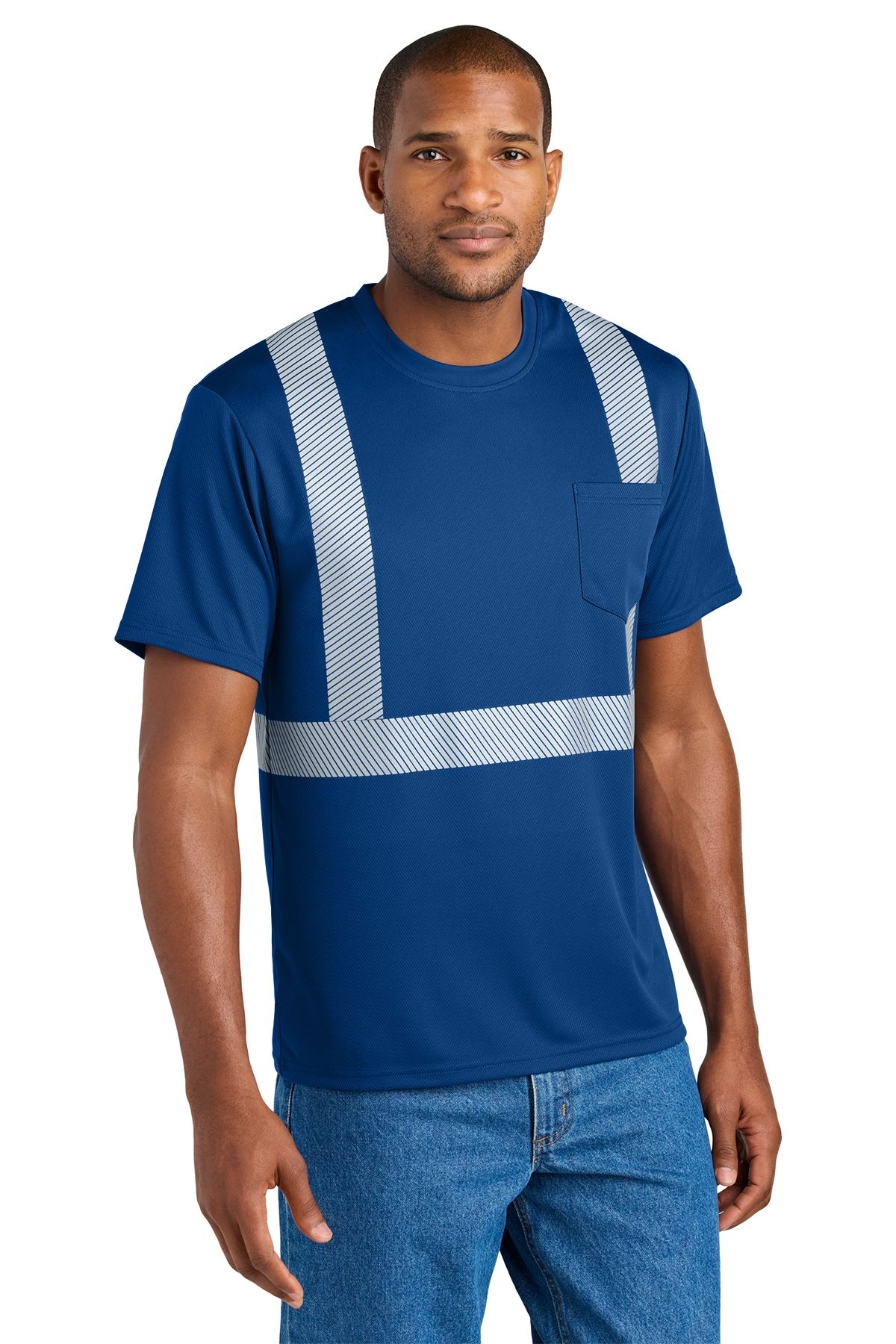 Man wearing a blue safety t-shirt with reflective stripes and a pocket, standing.