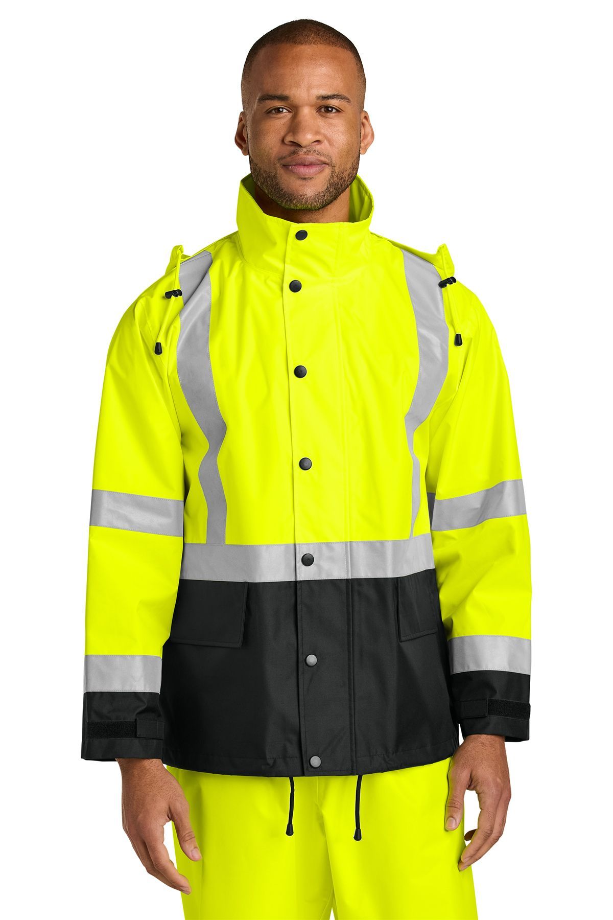 Man in a yellow and black safety jacket with reflective stripes.