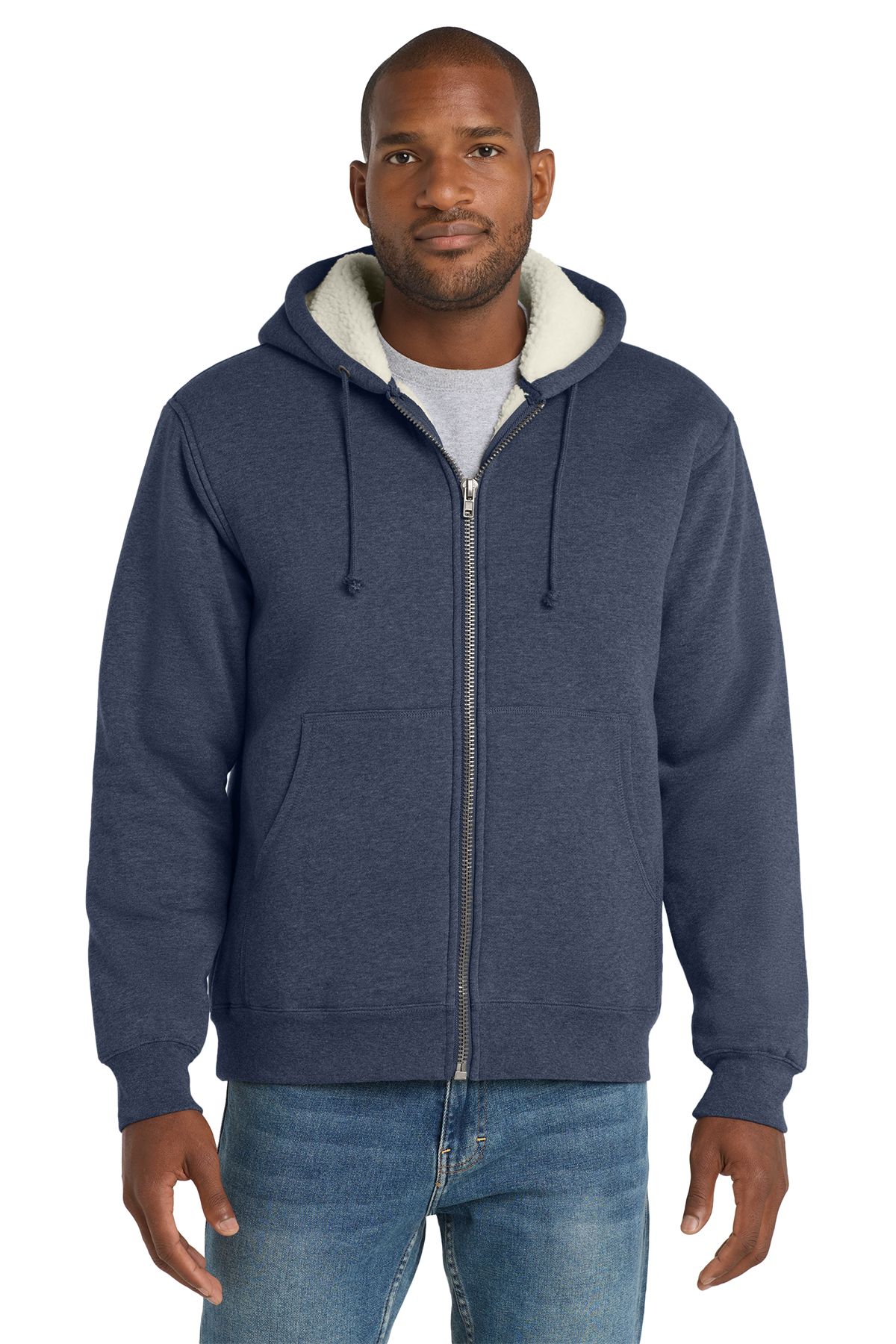 Man wearing a blue zipped hoodie with a fleece-lined hood, standing in front of a white background.